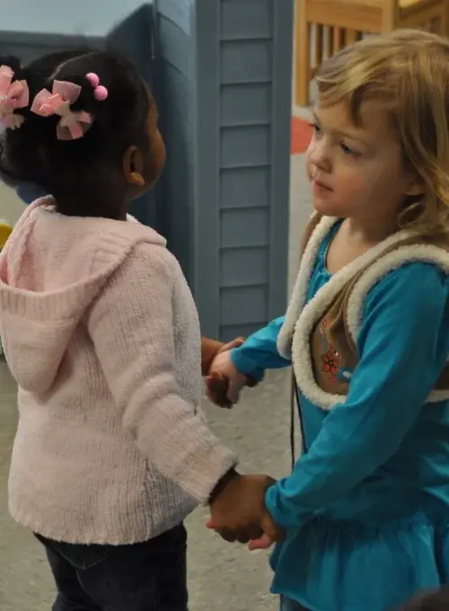 Two 2-year old girls dancing at Creative Childcare Academy and Camp