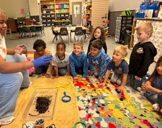 A group of 4-year old children learning about worms at Creative Childcare Academy and Camp