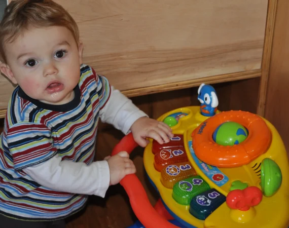 An infant learning numbers at Creative Childcare Academy and Camp