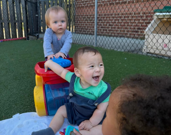 Infants playing at Creative Childcare Academy and Camp